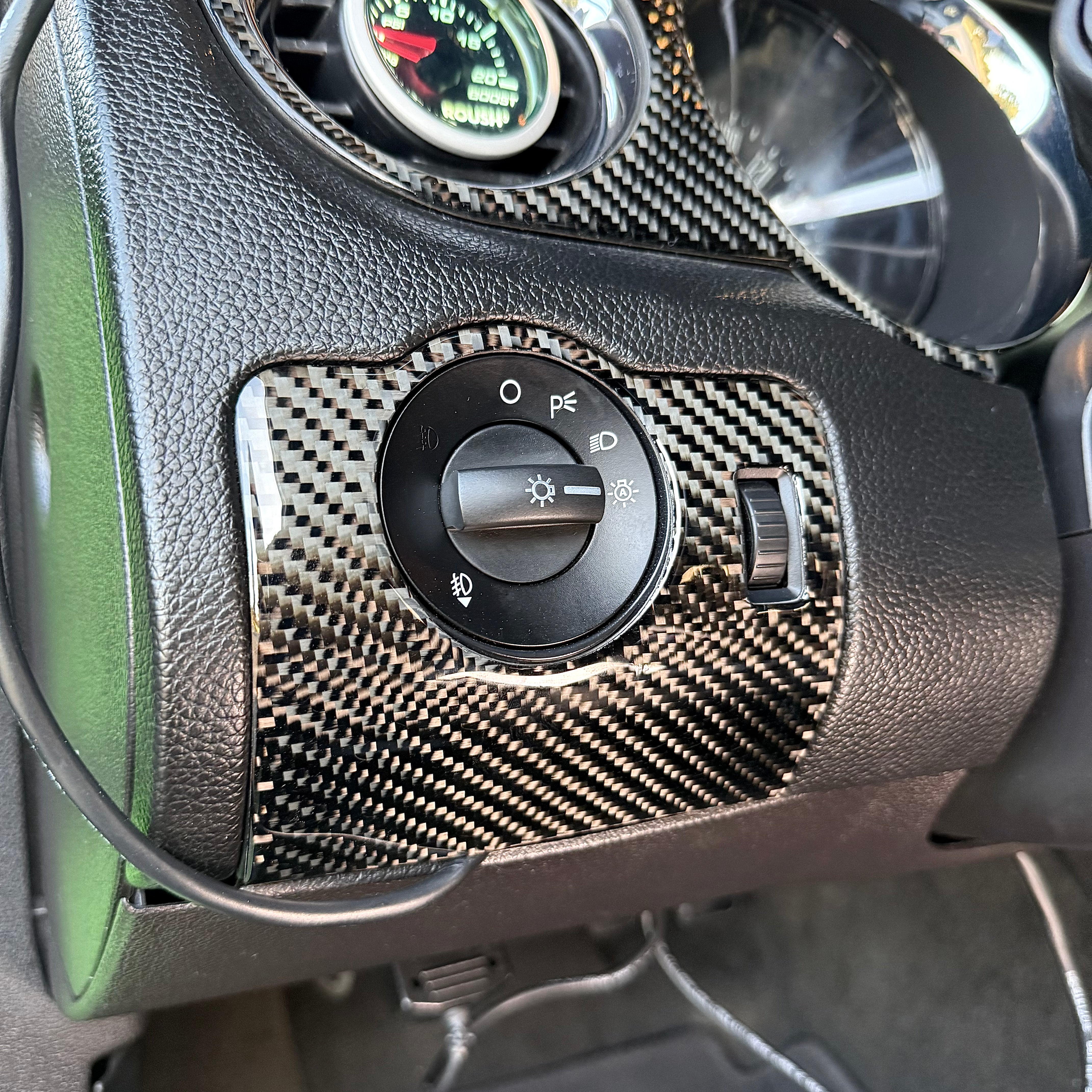 2010-2014 Carbon Fiber Headlight Control Overlay